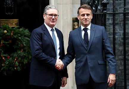Prime Minister of the United Kingdom Sir Keir Starmer greets French President Emmanuel Macron outside 10 Downing Street.