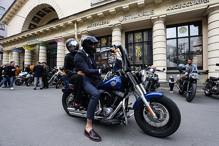Participants ride their motorcycles before the Distinguished Gentleman's Ride. A Distinguished Gentleman's Ride was held in St. Petersburg, joining a global motorcycle event that raises funds and awareness for prostate cancer research and men’s mental health through the Movember Foundation. Originating in Australia in 2011, the ride now spans 56 countries. Participants follow a strict dress code: classic suits for men, dresses for women, and ride only vintage or retro-style motorcycles.