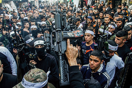 Palestinian gunmen from the Al-Aqsa Martyrs Brigades of the Fatah movement led by President Mahmoud Abbas seen carrying their weapons during the demonstration for the Palestinians who were shot dead by the Israeli army this year, in Balata refugee camp, east of Nablus, in the occupied West Bank.