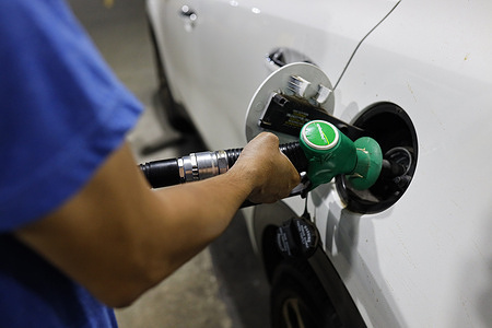 A member of the public fills their car with petrol at a petrol station In Melbourne. Fuel prices in Australia are under pressure as global oil markets react to escalating tensions involving Iran, the United States and Israel in the Middle East. The conflict has disrupted key oil supply routes and pushed crude prices higher, raising concerns that petrol costs for Australian motorists could increase in the coming weeks. Authorities and regulators are monitoring fuel retailers closely as price rises begin to appear at service stations across the country.