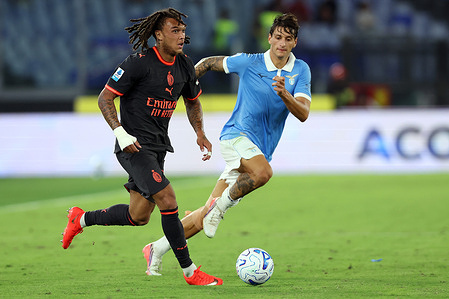 (L to R) Diego Moreira (Midfielder) of AC Milan and Romano Mussolini (Defender) of Lazio seen in action during the Italian Serie A- Enilive Championship 2026-2027 of the football match between SS Lazio vs AC Milan at Olympic Stadium. Final result match: Lazio vs Milan 2-2.