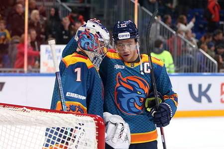 Andrei Kareyev (1), Spencer Foo (15) of Shanghai Dragons Hockey Club seen in action during the Hockey match, Kontinental Hockey League 2025/2026 between Shanghai Dragons China and Severstal Cherepovets at the SKA Arena. (Final score; Shanghai Dragons 2:4 Severstal Cherepovets).