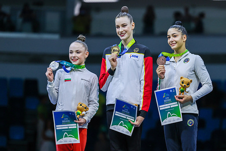 (L-R) Nikolova Stiliana (BUL) silver medal, Darja Varfolomeev (GER) gold medal and Sofia Raffaeli (ITA) bronze medal are seen during the Rhythmic Gymnastics FIG World Championships 2025 Rio de Janeiro at Parque Olimpico.