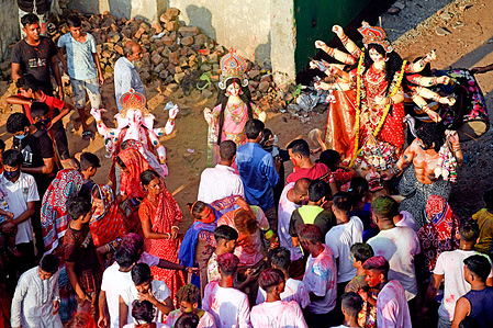 Hindu devotees prepare to immerse a clay idol of the Hindu Goddess Durga in the Buriganga River on the final day of the Durga Puja festival in Dhaka.
