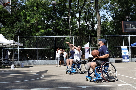 Participants of the adaptive festival seen playing basketball in wheelchairs at the Old Market Square (Starobazarny Square). The adaptive sports festival was held in Old Market Square (Starobazarny Square). Participation was completely free. It was organized by the civil organization "Vilni Voini." According to Handicap International as of early 2026, 300,000 people in Ukraine had suffered war-related injuries. Such events are essential for the physical and psychological adaptation of veterans of the Ukrainian-Russian war.