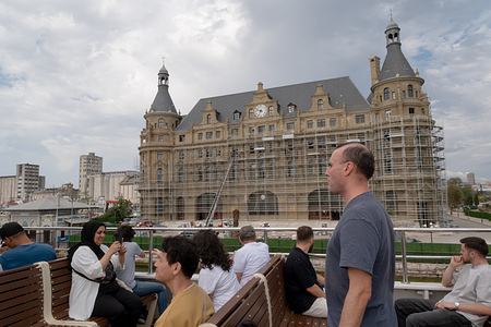 People are looking at Haydarpasa Station from the ferry. Daily life in Istanbul