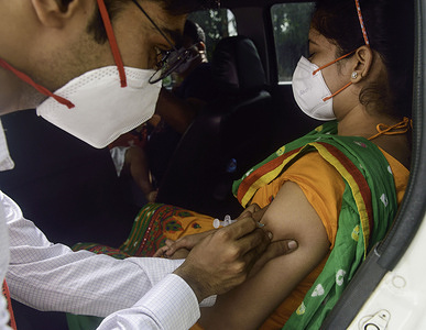 People get their Covid-19 Vaccine from a Drive-through Vaccination Centre in Kolkata.Their is a huge demand for vaccine amid the prediction of covid-19 third wave.
