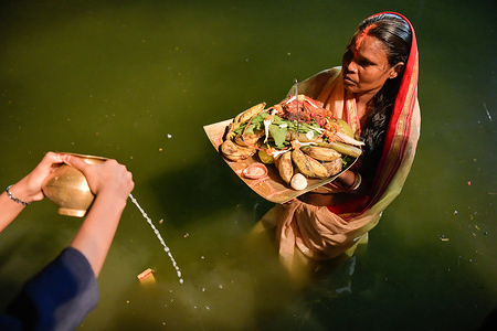 Indian Hindu devotees perform rituals during the festival.
Chhath Puja is a festival dedicated to the Sun and his sister 'Chhathi Maiyya' in honour for their blessings on earth.