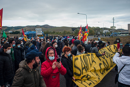 Protesters hold a banner during the demonstration.Demonstrators protest outside the Catanzaro city council building against the lack of sanitary services as the Regional Affairs Minster Francesco Boccia arrives at the council building for a regional conference.