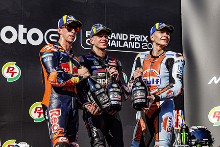 Number 37 Red Bull KTM Factory Racing rider Pedro Acosta , Number 72 Aprilia Racing rider Marco Bezzecchi, Number 25 Trackhouse MotoGP rider Raul Fernandez on the podium after the race at the 2026 PT Grand Prix of Thailand.