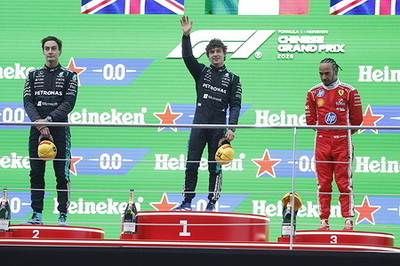 Race winner Andrea Kimi Antonelli (C) of Italy and Mercedes AMG Petronas F1 Team seen on the podium with Second placed George Russell (L) of Great Britain and Mercedes AMG Petronas F1 Team and Third placed Lewis Hamilton (R) of Great Britain during the F1 Grand Prix of China at Shanghai International Circuit.