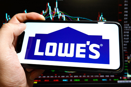 In this photo illustration, a Lowe's Co. logo is displayed on the screen of an iPhone.
