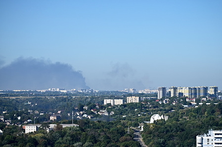 Smoke rises from fires in warehouses damaged by Russian drone strikes. Russian forces launched a massive attack on Kyiv region with drones, hitting warehouses.