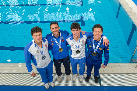 (L to R) Silver medallist Matteo Santoro, gold medallist Giovanni Tocci and bronze medallists Valerio Mosca and Juan Pablo Cortes Zapata on the podium after the Italian Absolute Indoor Open Diving Championships – Men’s 3m Springboard Final in Turin, Italy