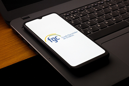 In this photo illustration, the FGC (Fundo Garantidor de Créditos) logo is seen displayed on a smartphone screen.