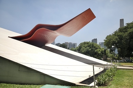 The entrance to the Ibirapuera Park auditorium, in Sao Paulo Brazil. Inaugurated in 2005, the building was conceived by Brazilian architect Oscar Niemeyer for the presentation of musical spectacles.
Oscar Niemeyer is one of Brazil's most famous architects. He belongs to the International Style movement. He is best known for building Brazil's capital Brasilia with urban planner Lúcio Costa, inaugurated in 1960.