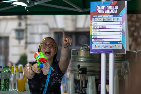 A woman carries a water pistol during an LGTBIQ+ pride demonstration Two demonstrations marched through the city center of Valencia to commemorate Pride Day. One was the LGBTQ+ pride demonstration under the slogan "Now more than ever: Pride," and the other was the alternative Critical Pride demonstration, which denounced the "pinkwashing" of institutions targeting the community.