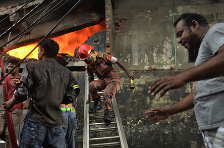 Firemen seen trying searching for survivors during the fire.
At least 34 workers died in a fire that ripped through a factory in Bangladesh. The fire was so fierce it took fire crews 36 hours to extinguish -- and rescue workers still couldn’t enter the building afterwards for fear it would collapse. Crews are still clearing through the rubble.