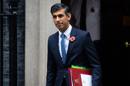 Prime Minister Rishi Sunak leaves 10 Downing Street for Parliament to take his second Prime Minister’s Questions in London. This morning, Sunak announced that he would be attending the COP27 climate change summit in Egypt after previously saying he would skip it to focus on preparations for the Autumn Statement.