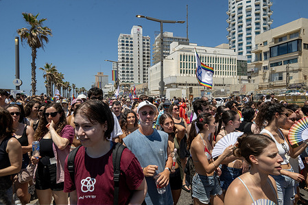 A crowd of participants takes part in the Pride Parade in Tel Aviv in support of the LGBTQ+ community and their rights. The Pride Parade in Tel Aviv, Israel, took place after a three-year hiatus due to ongoing conflicts. Thousands of people took part in the march in support of love, pride, and equal rights for the LGBTQ+ community. Following a recent Iranian missile attack, the parade was also a display of resilience during a fragile ceasefire. Some participants carried placards featuring the face of Iran’s Supreme Leader, Mojtaba Khamenei, mockingly portrayed as an LGBTQ+ supporter.