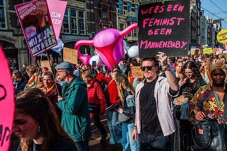 Protesters are walking with a big inflatable vulva during the rally. People gathered at Dam Square to stand up against violence and femicide, to defend human rights and challenge unequal power structures, including gender inequality. The Feminist March, the successor to the Womenís March, is organized annually to advocate for womenís rights.