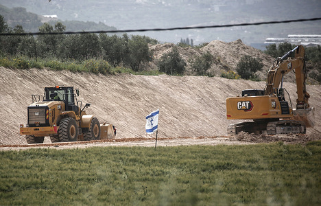 Israeli bulldozers are clearing a road to the Israeli settlement of Snur, near the city of Jenin in the northern occupied West Bank. Signs welcoming residents and inviting them to return, written in Hebrew, mark the site. The settlement was reopened today under the auspices of the Israeli defense and finance ministers, after being demolished in 2005 as part of Israel's withdrawal from Gaza.