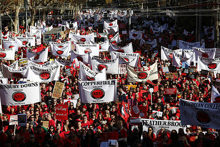 Protesters hold banners of the Australian Education Union (AEU) during the rally. Thousands of members of the Australian Education Union (AEU) marched from Bourke Street Mall to the Victorian Parliament in Melbourne, calling for better pay, improved working conditions, increased public school funding, and a revised Victorian Government Schools Agreement (VGSA).