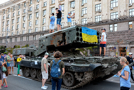 People inspect the destroyed Russian army equipment displayed at Khreshchatyk in the center of Kyiv. Captured Russian military equipment is being temporarily displayed on Khreschaytk street in the heart of the Ukrainian capital. The area has become a popular attraction among residents curious to see Ukraine's spoils of war.