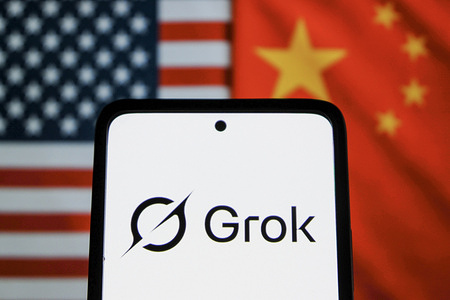 In this photo illustration, the Grok logo is seen displayed on a smartphone with the American and Chinese flag in the background.
