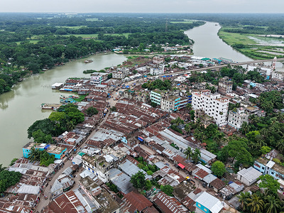(EDITORS NOTE: Image taken with drone)
An aerial view of upazila market surrounded by the winding Arial Khan River in Muladi, Barishal. Muladi Upazila is a sub-district of Barishal District in southern Bangladesh. Located on the banks of the Arial Khan River, it is known for its riverine beauty, fertile lands, and agricultural activities. The upazila includes several unions and villages, with most people engaged in farming, fishing, and small-scale trade. Like many parts of Barishal, it faces challenges such as river erosion and seasonal flooding.