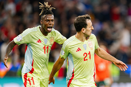 Nico Williams (L) and Mikel Oyarzabal (R) of Spain celebrate a goal during the UEFA Nations League 2025 final match between Portugal and Spain at Munich Football Arena. Final score: Portugal 2:2 (penalties 5:3) Spain.
