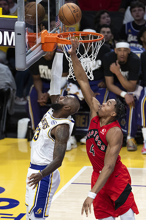 Los Angeles Lakers’ LeBron James (23) goes past Toronto Raptors' Scottie Barnes (4) to the basket during an NBA basketball game at Crypto.com Arena. Final score: Lakers 110:93 Raptors