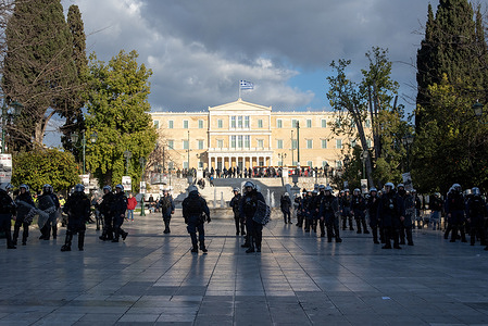 Riot police stand in lines on the Syntagma Square in Athens during the demonstration. Thousands of protesters gathered on the Syntagma Square in Athens, Greece. To mark the third anniversary of the deadliest train crash of the Greek history. The collision killed 57 passengers nearby the village called Tempi.
