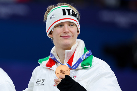 Bronze medalist Daniel Grassl of Italy celebrates during the Figure Skating Team Event Finals Podium of the Milano Cortina 2026 Winter Olympics at Milano Ice Skating Arena in Milan.