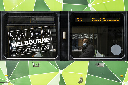 A man wearing a face mask sits in a tram amid coronavirus crisis.
Under the stage 4 restriction of lockdown due to the second wave of Covid 19, the city appears to be desolate with only a few people around for essential reasons. This harsh lockdown is unlikely to be eased on Sunday as expected.