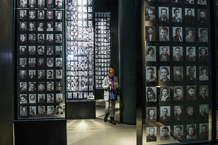 Visitors look at a mural with pictures of jewish victims in one of the exhibit rooms at the World War 2 Museum.
The world war 2 museum in the Polish city of Gdansk was opened on 27th of March 2017. The museum exhibits world war 2 history in Europe. The Museum building was designed by the Kwadrat architectural team.