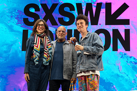 Brian Eno, Jacob Collier and Cathy Runciman seen on stage at SXSW London. South by Southwest (SXSW) London brought together leaders from media, music and technology across Shoreditch on Thursday, with featured sessions at Shoreditch Town Hall including “The Next Frontier: Audience Building in the Platform Era” with television presenters Ant McPartlin and Declan Donnelly. The programme also included an EarthPercent presentation featuring musician and environmental advocate Brian Eno alongside Jacob Collier, while the “Headlines and Harmonies” discussion brought together singer Katherine Jenkins and broadcaster Piers Morgan as part of the festival’s opening-week programme.
