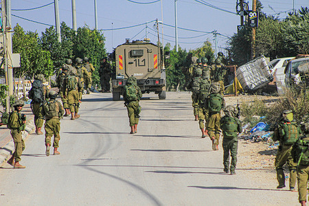 Israeli soldiers are seen during a large-scale raid to arrest wanted Palestinians in Balata refugee camp in the east of Nablus in the northern West Bank.