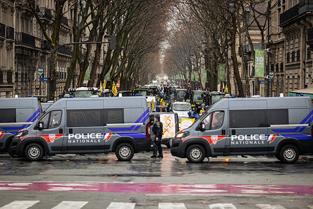 A French National Police unit blocks a street near the Eiffel Tower where farmers of the Coordination Rurale union, CR , were protesting. Farmers of the Coordination Rurale union, CR , protest near the Eiffel Tower as part of a nationwide day of protests and actions called by several farmers unions to push the French government to block the Mercosur trade deal and protest against its handling of the nodular dermatitis (CND) epidemic, in Paris, France.