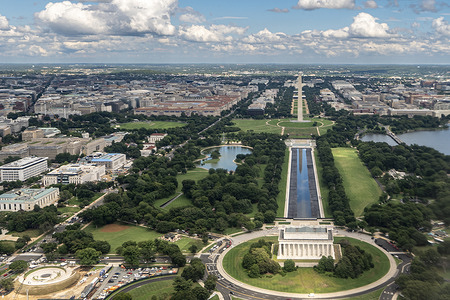 The Washington Monument is reflected in water that has gathered in the bottom of the Reflecting Pool which remains largely empty as repairs are underway to the lining in Washington.