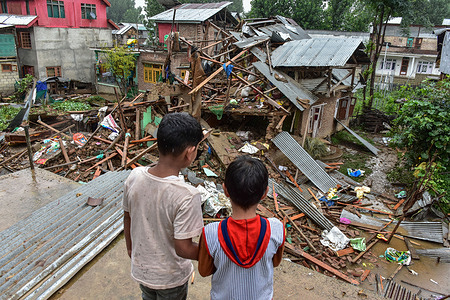 Kashmiri children gather near a blown-up house of Haroon Ganai, a militant suspected in policeman's killing, in Hassanpora, south of Srinagar, the summer capital of Jammu and Kashmir. A day after a police officer was killed in a militant attack in south Kashmir’s Anantnag district, authorities on Thursday demolished the houses of two militants in the area. Security agencies have not said whether the two militants were linked to the killing. Since the attack, police said over 2,500 people are detained as suspects.