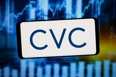 In this photo illustration, the logo of investment company CVC Capital Partners plc is displayed on a smartphone in front of abstract background on computer screen.