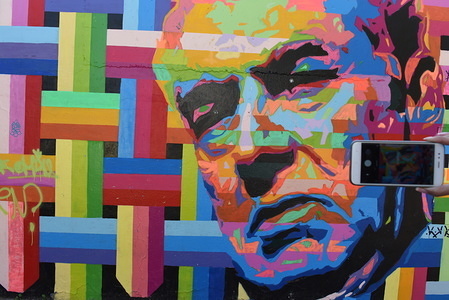 Street art in Bellavista neighbourhood.
Bellavista is located between the north bank of the Mapocho River and San Cristóbal Hill, it displays dozens of giant artworks painted on the colourful buildings.