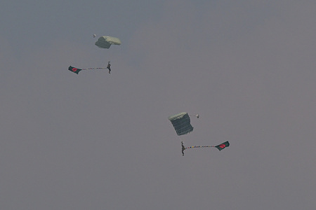 Bangladeshi paratroopers participate in an aerial display during celebrations to mark the country s' 54th Victory Day.