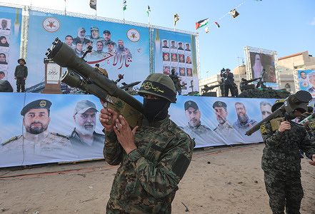 Fighters from the Palestinian Islamic Jihad group participate in a rally to commemorate armed commanders and operatives killed during the Israeli airstrike in Gaza. Dozens were killed and many homes were destroyed during five days of fighting which erupted when the Israeli military launched deadly strikes against top militants from the Islamic Jihad militant group.