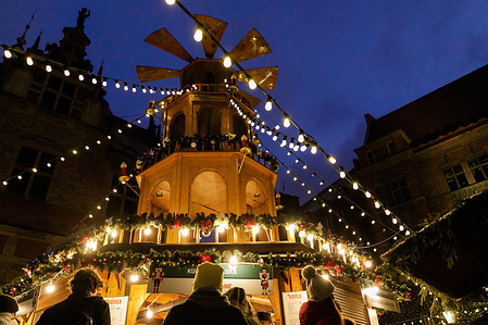 People queue for street food at Angel Mill construction during the Gdansk Christmas Fair. According to the rank of Best Christmas markets in Europe on the official website of the Best Destinations in Europe, the Gdansk Christmas Fair is considered one of the most beautiful in Poland. There are 120 stalls with unique gifts, decorations and regional products in the Old Town.