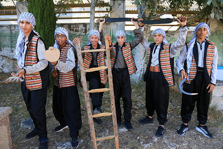 A Palestinian theatrical performance depicting the lives of Palestinian farmers and refugees during a refugee celebration in Balata camp, east of Nablus in the West Bank.
