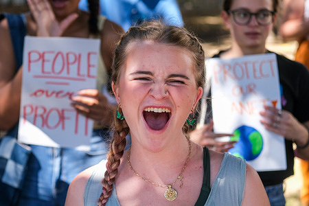 A climate protester shouts slogans during a Global Climate Strike rally in Los Angeles. Youth and community organizers gather as part of the "Global Climate Strike'' to call for divestment from fossil fuels and investment in green infrastructure and to highlight what it's like to suffer on the frontlines of environmental racism and the climate crisis.
