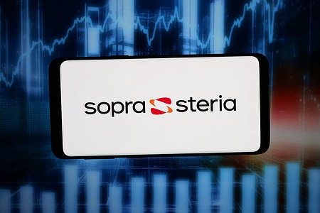 In this photo illustration, the logo of French company Sopra Steria Group SA is displayed on a smartphone in front of abstract background on computer screen.