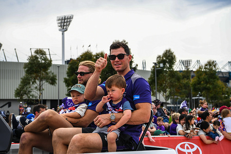 Corey Wagner (L) and Jaeger O'Meara (R) of Fremantle Dockers seen during 2026 AFL Grand Final parade at the Olympic Park. The AFL Grand Final Parade is a highlight of the AFL Grand Final week, featuring the Grand Final teams and their players as they parade through the city 's sporting precinct. The parade includes a cavalcade of players and officials from both finalist teams.